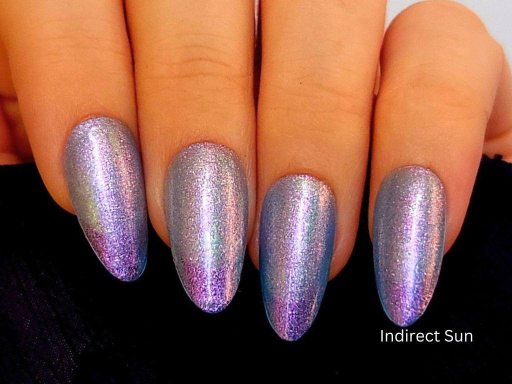 Sheer blue indie polish with purple shift – light skin tone swatch
