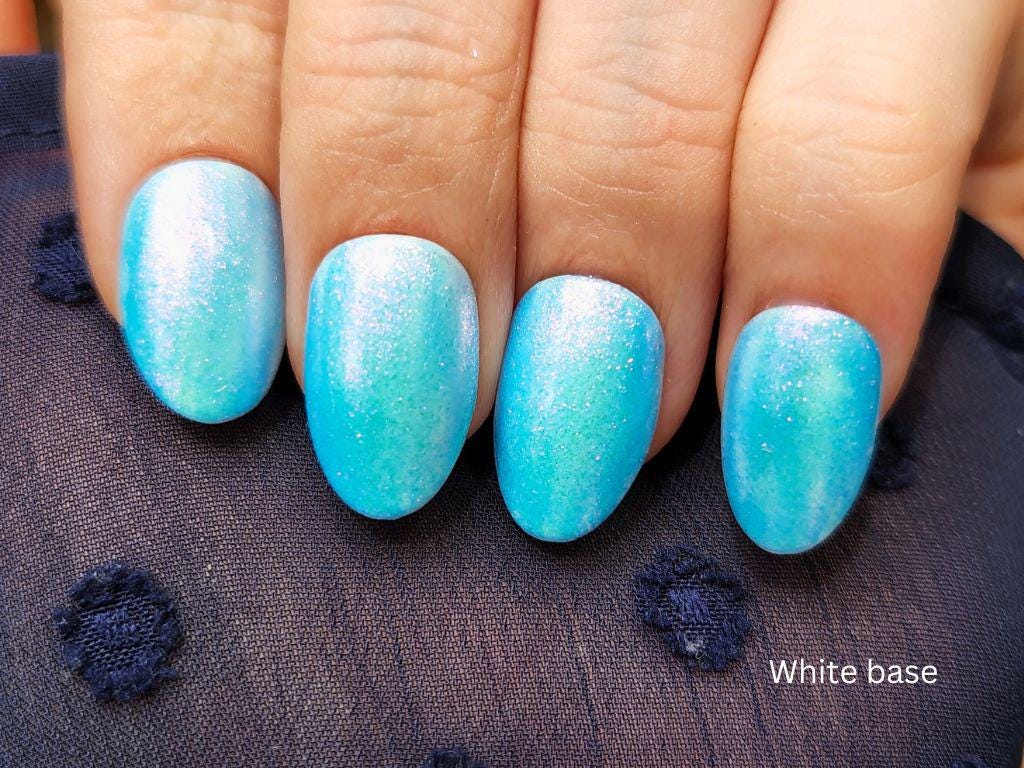 Blue shimmer topper over white base – cruelty-free and handmade indie polish