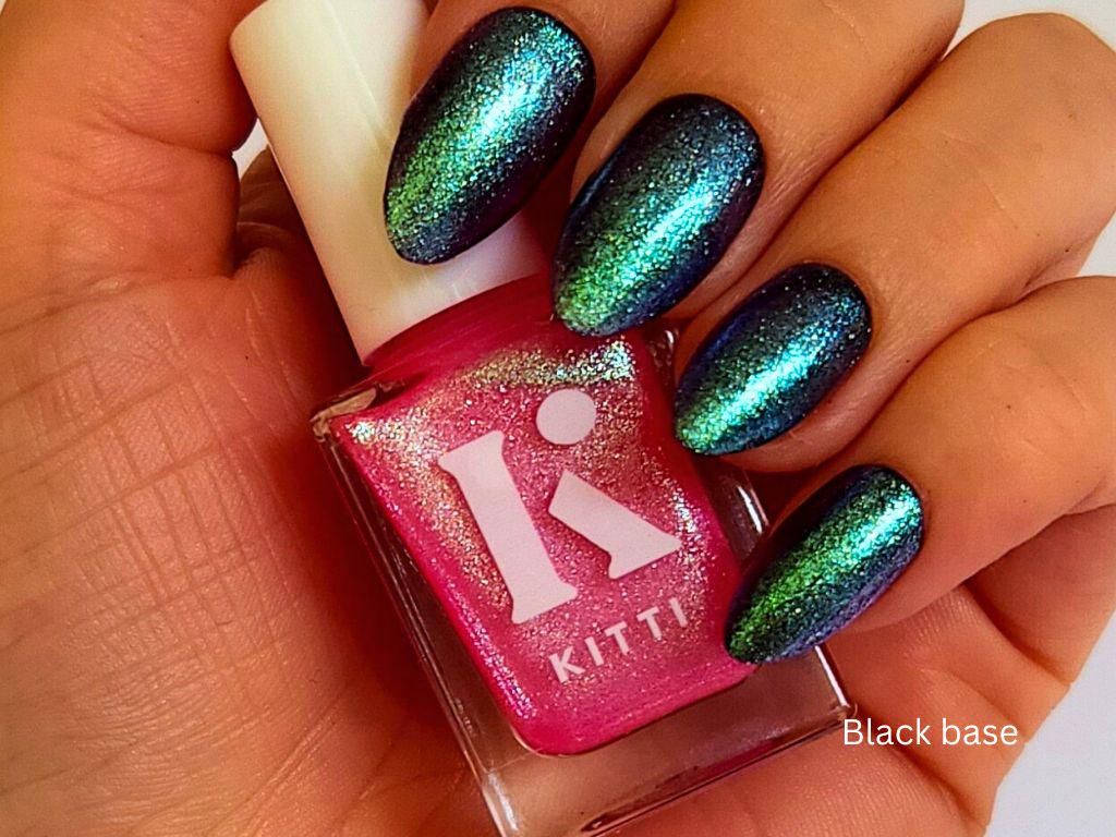 Glow Show over black polish – hot pink shimmer with bold blue-green-silver shift