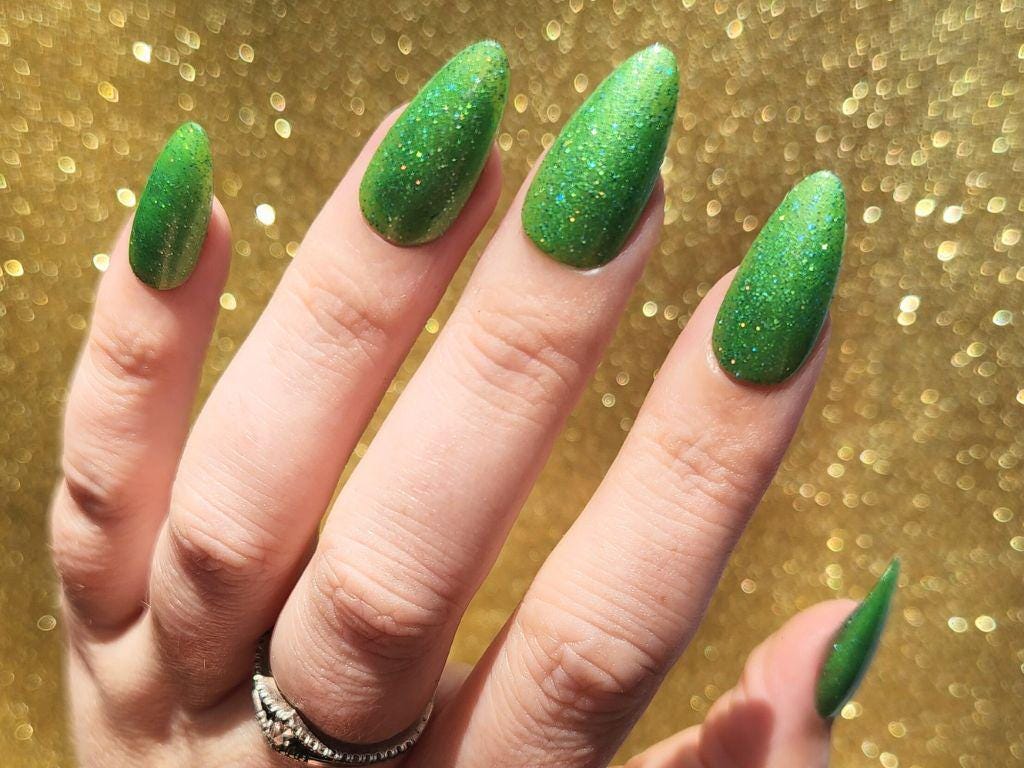 Bright green polish with holographic glitter – full opacity in 2 coats