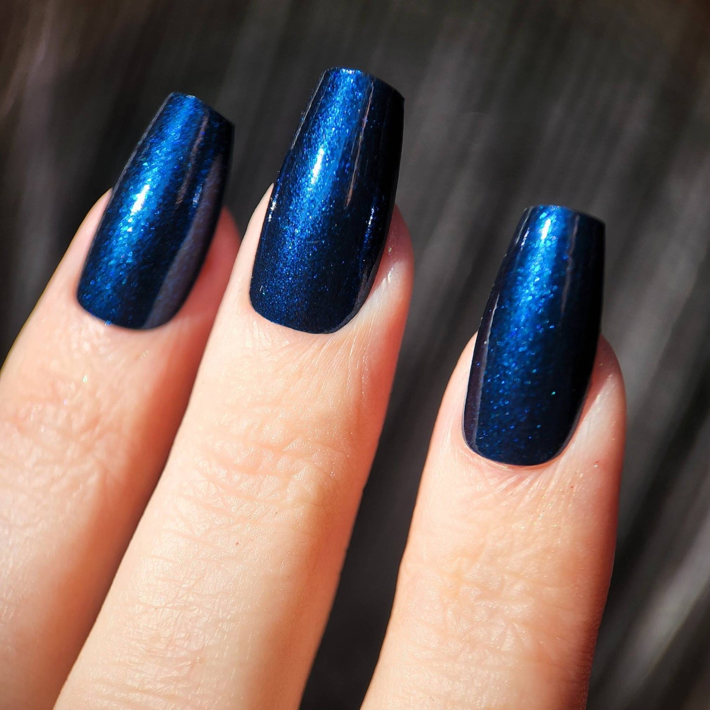 Shimmery deep navy polish with a dreamy jelly texture
