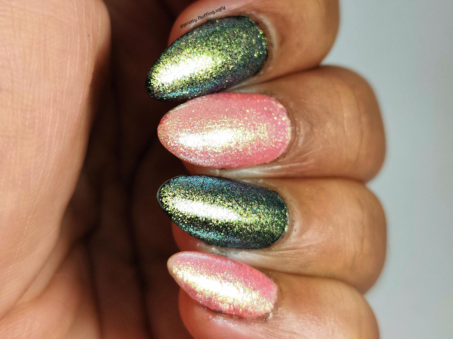 Glow Hard or Go Home polish on dark skin – sheer pink shimmer with gold-green glow