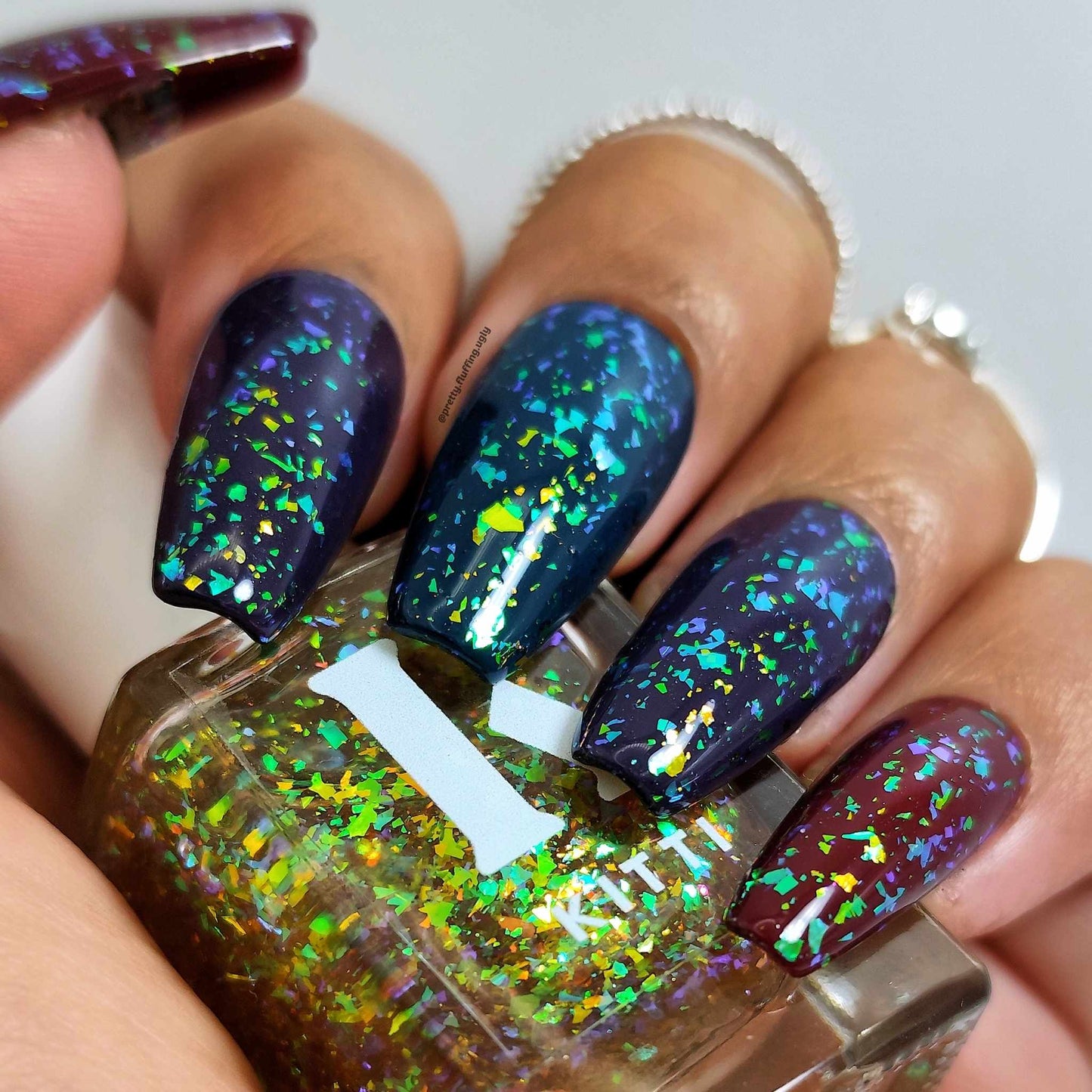 Flakie nail swatch on dark skin tone