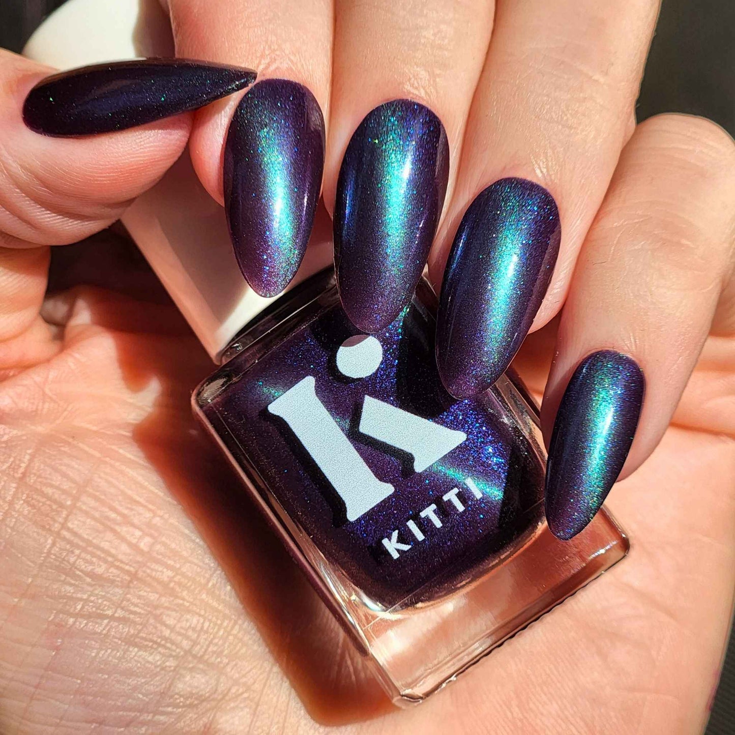 Purple magnetic nail polish with green cat eye effect – You Had Me at Hocus