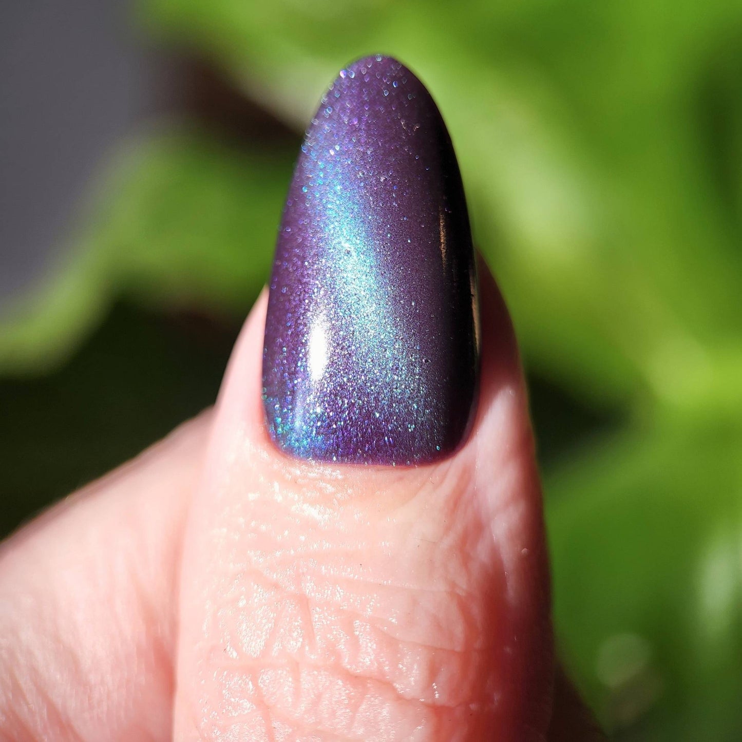 Close-up of You Had Me at Hocus with green magnetic cat eye