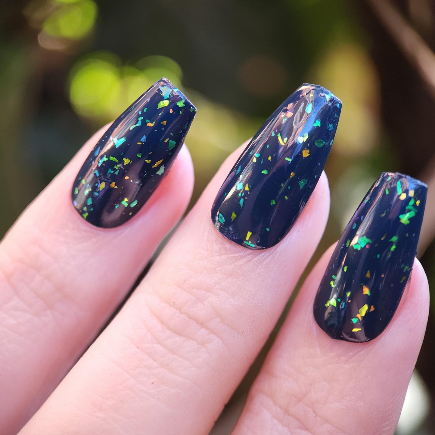 Indie polish topper with yellow-green-blue iridescent flakes