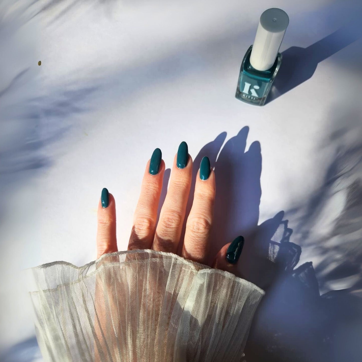 nail salon at home with deep teal nontoxic nail polish