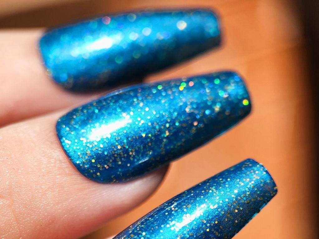 Deep blue holographic nail polish on light skin tone – Looking for a Man in Finance
