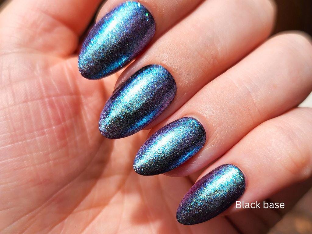 Multichrome shimmer nail topper on black base – cruelty-free and long-wearing