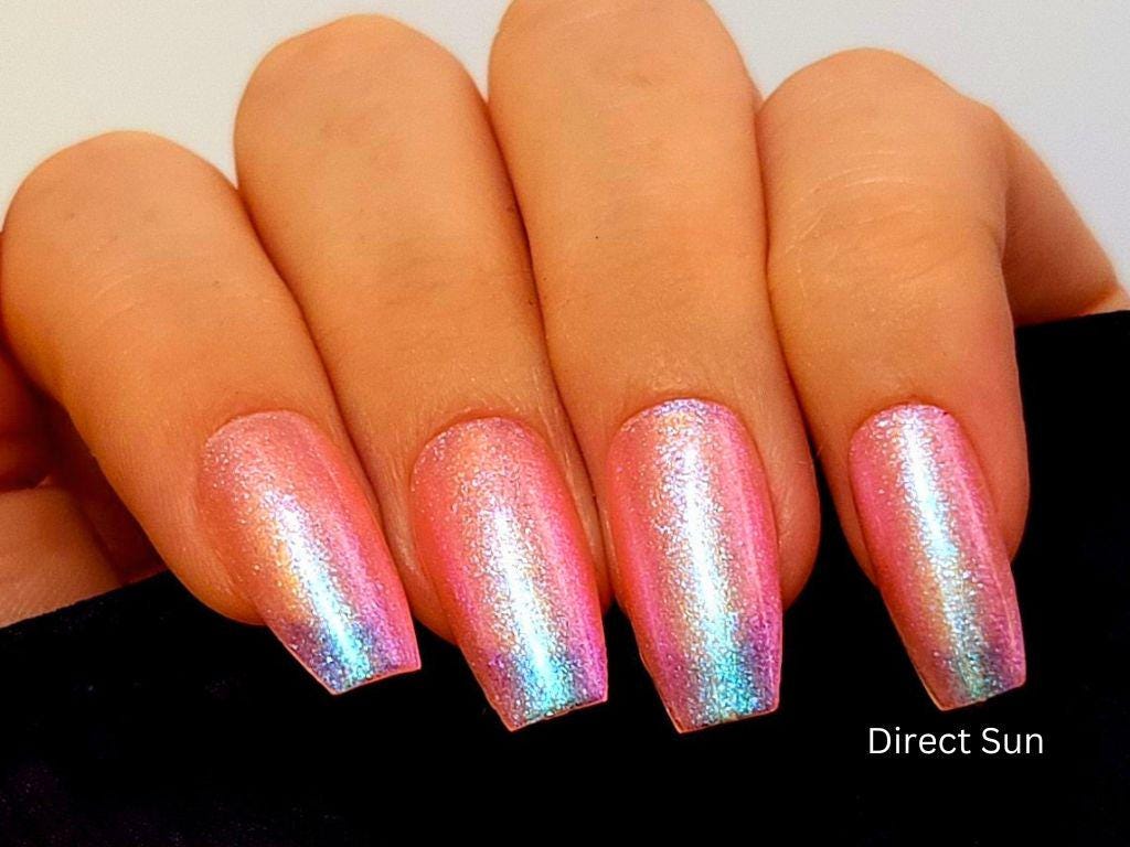 Macro of Glow Up polish – close-up of peach base with cool shimmer particles