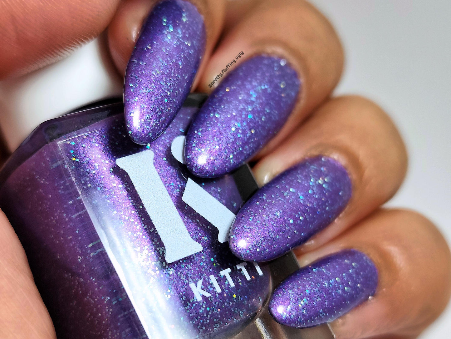 Unhinged After Dark on deep skin – indie nail polish with turquoise glitter