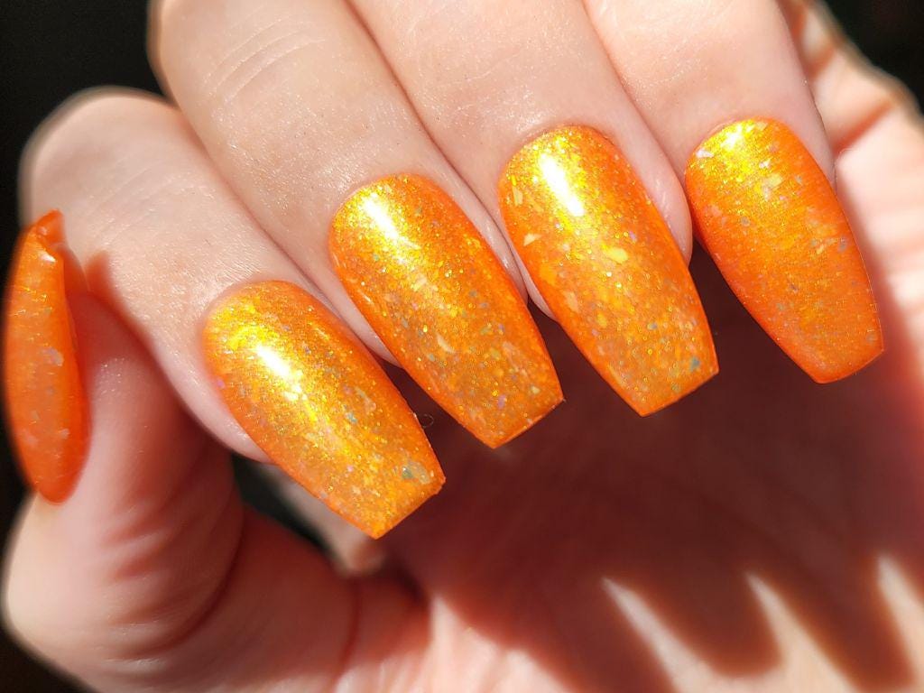 Glowy golden nail polish under sunlight – Here Comes the Sun