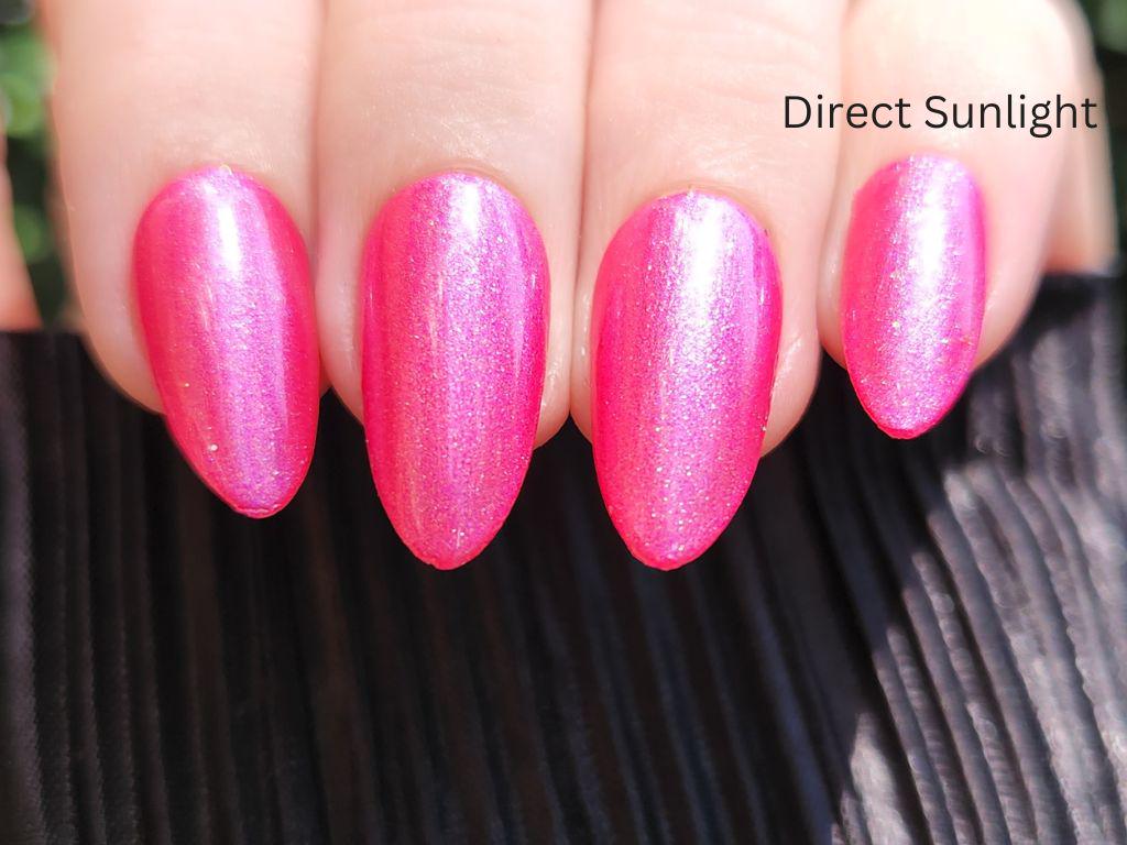 Hot pink shimmer polish layered in two coats – vibrant finish