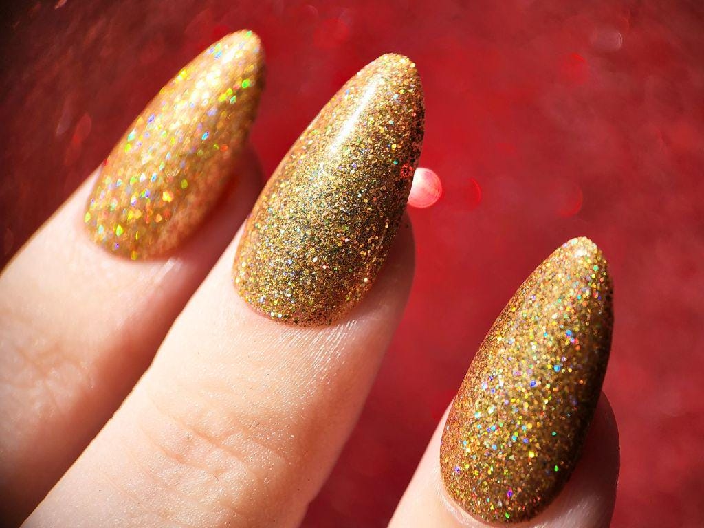 Holographic autumn glitter polish close-up – fiery sparkle finish