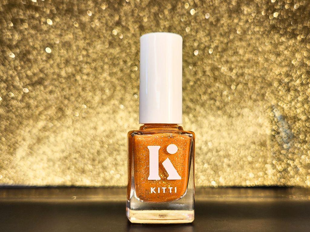 Australian-made vegan nail polish bottle – bold orange glitter shade
