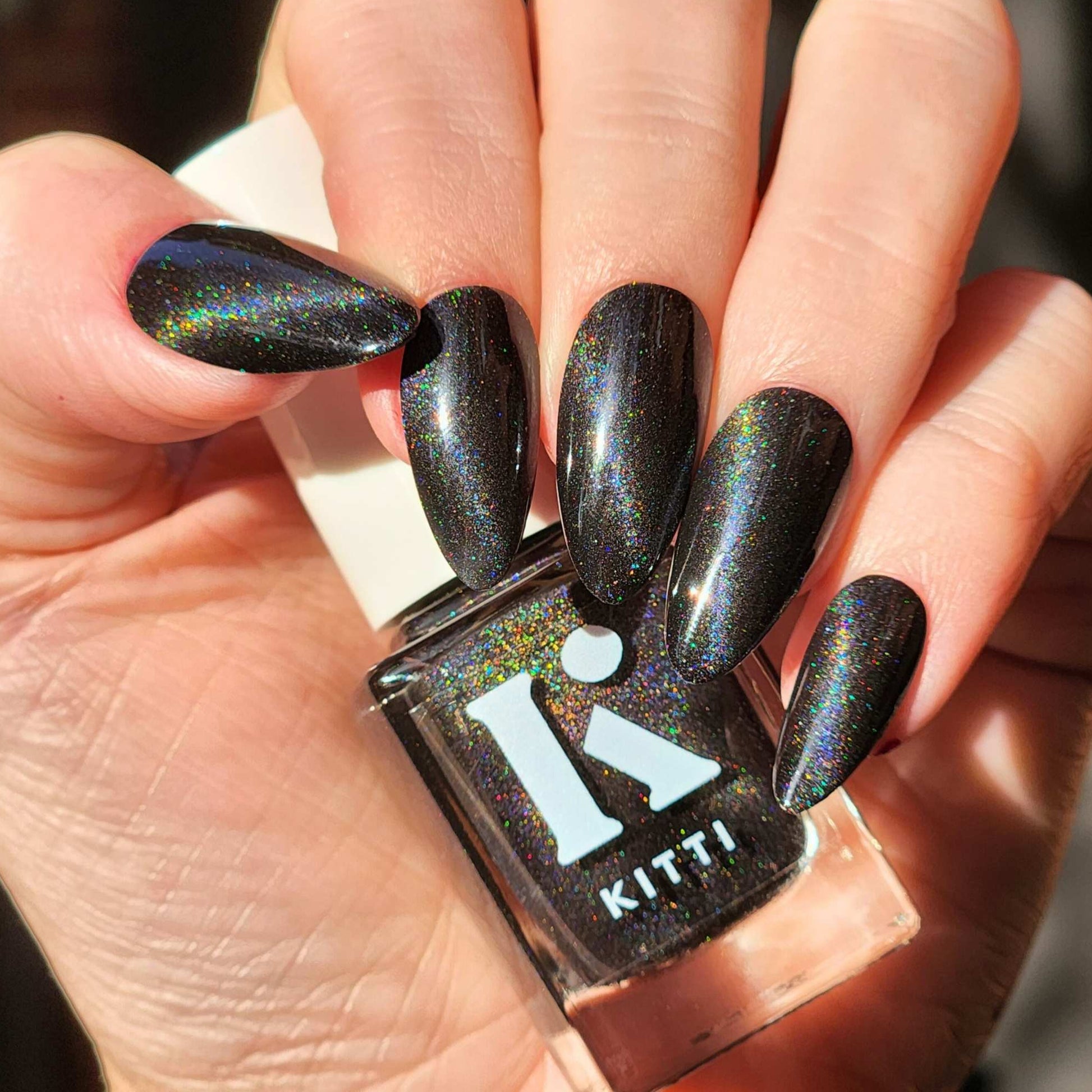 Glossy black nail polish with holographic magnetic finish Kitti Nails
