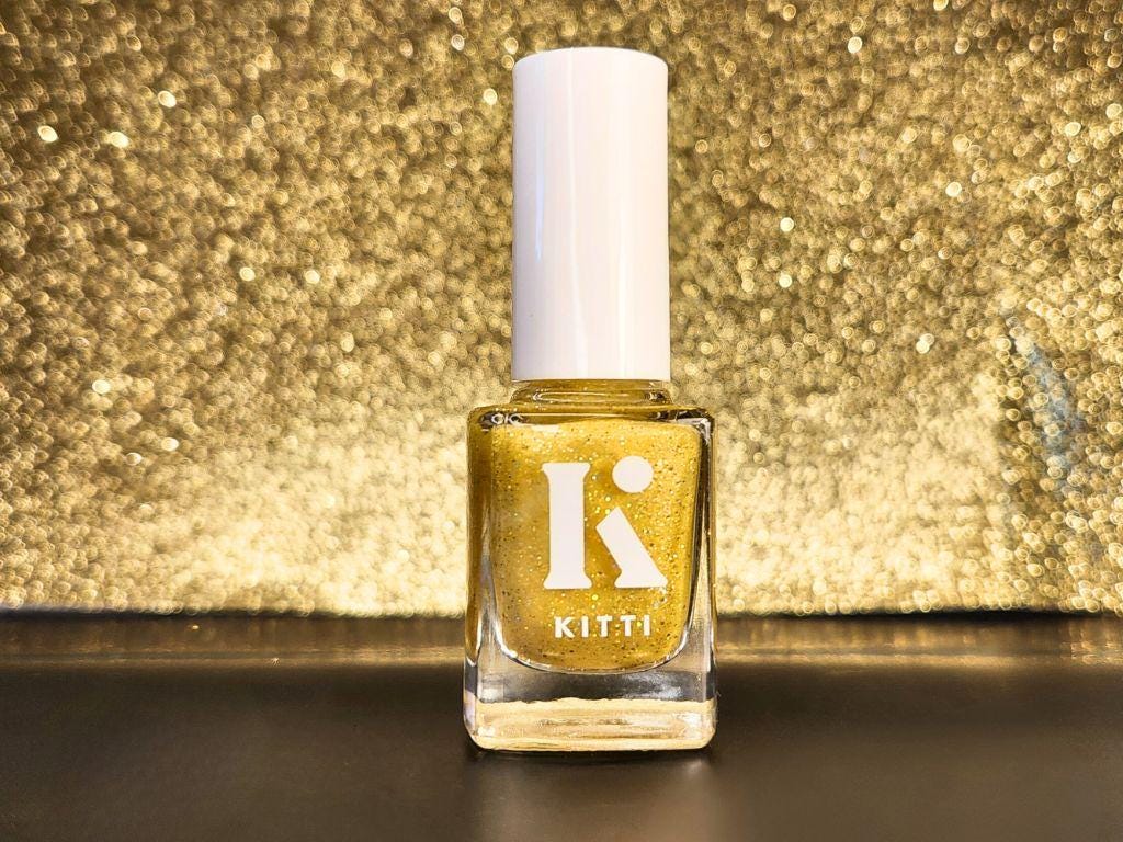 Bottle shot of Swipe Right for Mayhem – bold yellow indie polish with gold holographic glitter