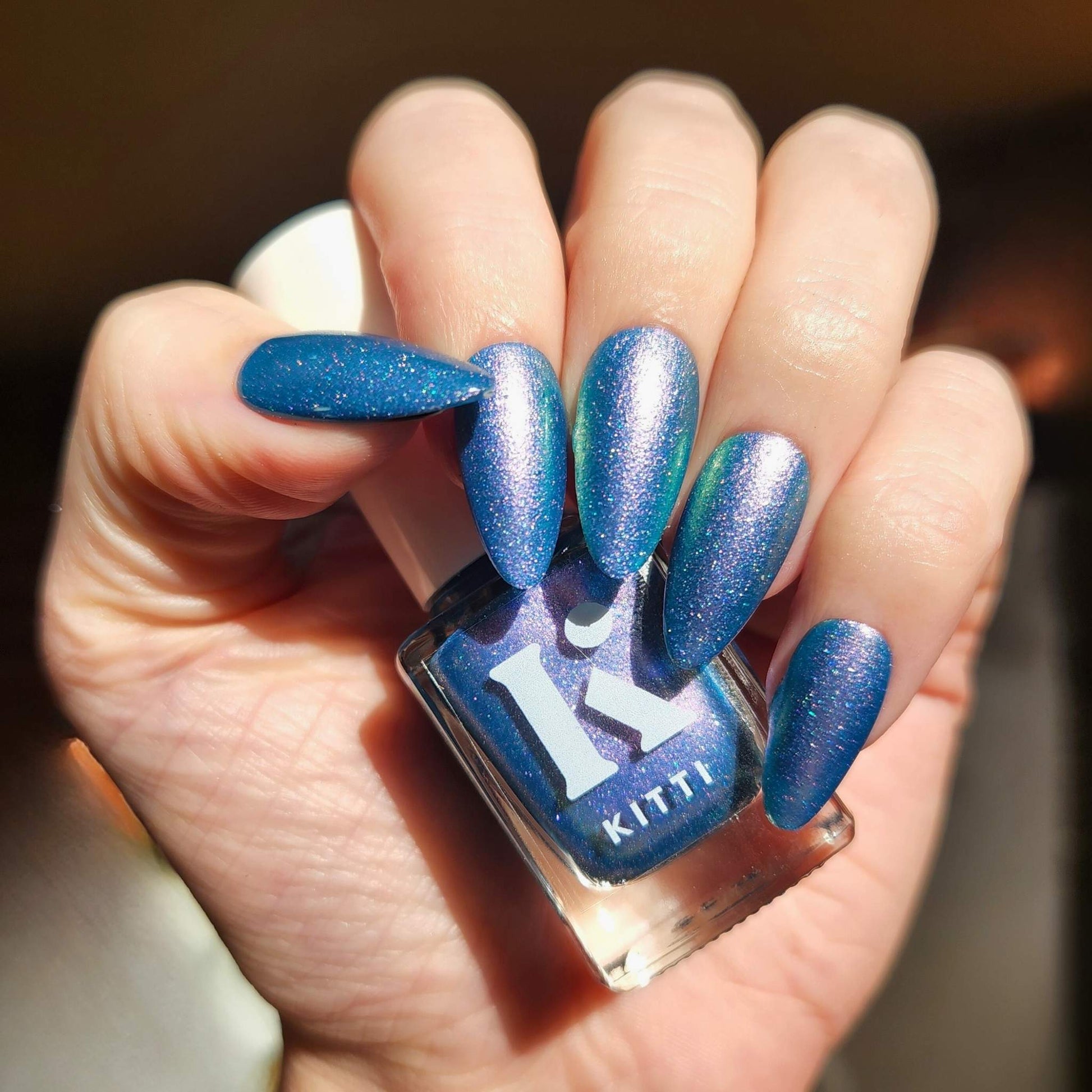Blue to purple holographic nail polish