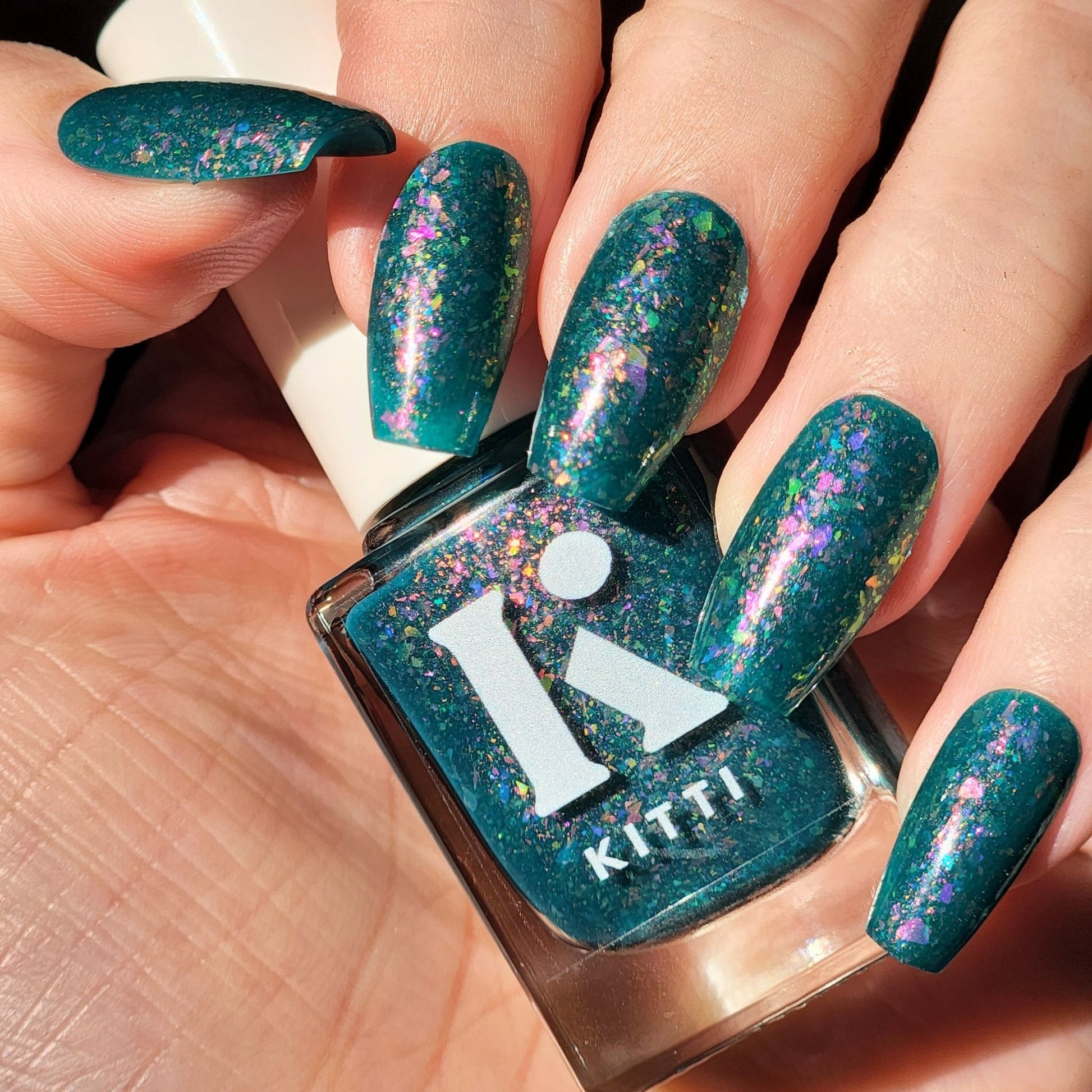 Deep teal jelly nail polish with iridescent flakes – Just a lil’ Cursed