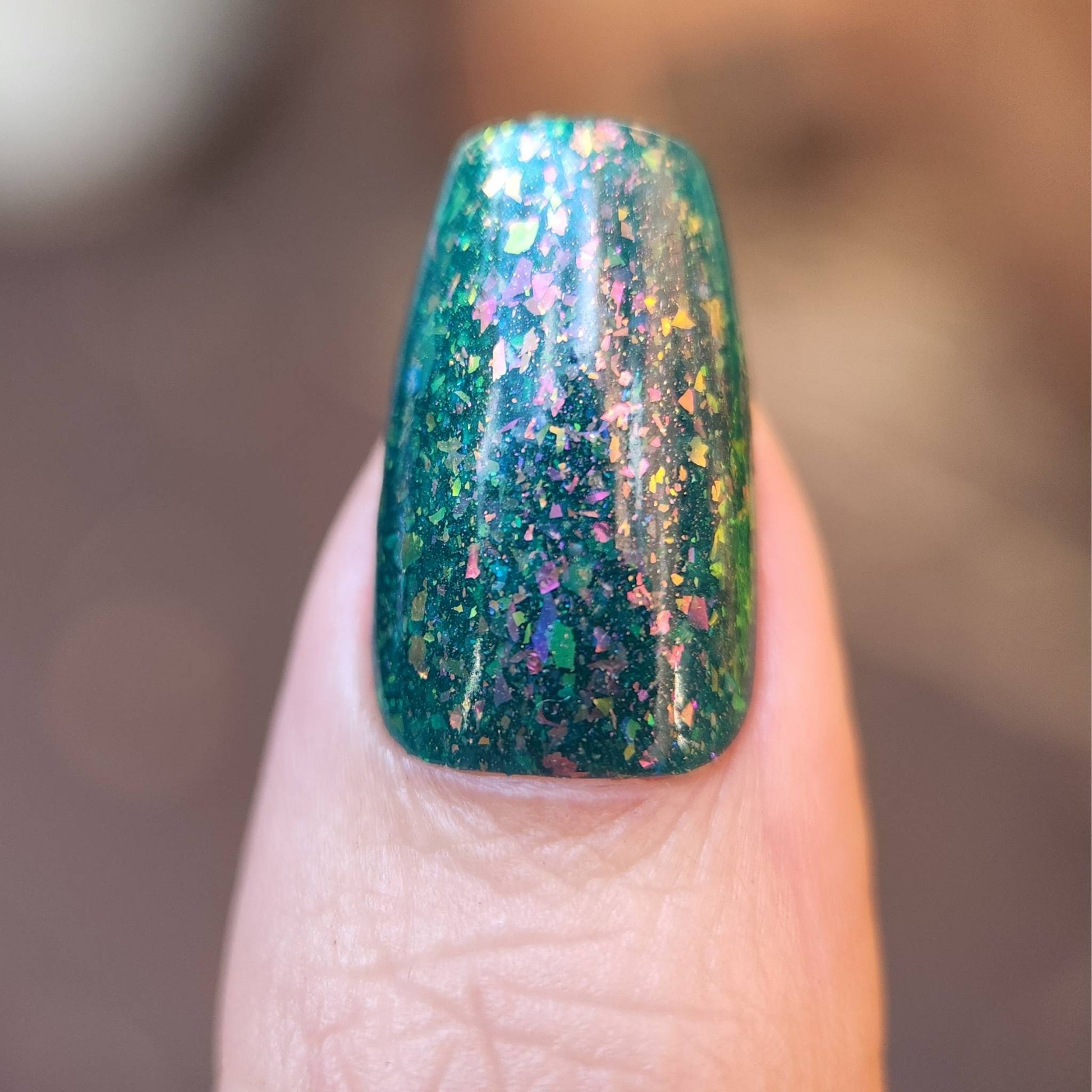 Vegan indie nail polish in deep teal with color-shifting effect