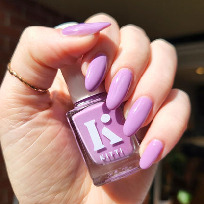 Close-up of nails painted with Lavender Fog – glossy pastel purple polish