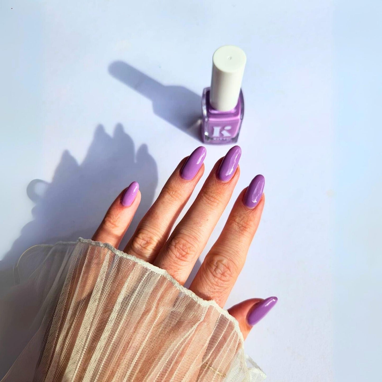 Mid-tone purple pastel nail polish swatched on nails – Lavender Fog