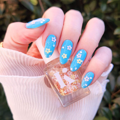 Petal Party spring nail polish topper by Kitti Nails – clear base with pastel daisy glitter