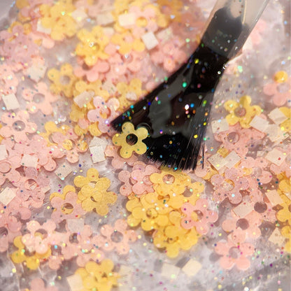Limited edition Spring 2025 polish topper packed with chunky pastel flower glitters