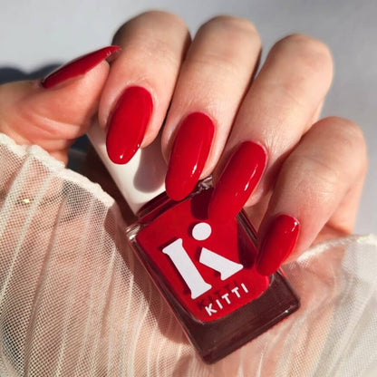 Long-lasting vegan red crème polish swatched on nails – Poppin' Cherries