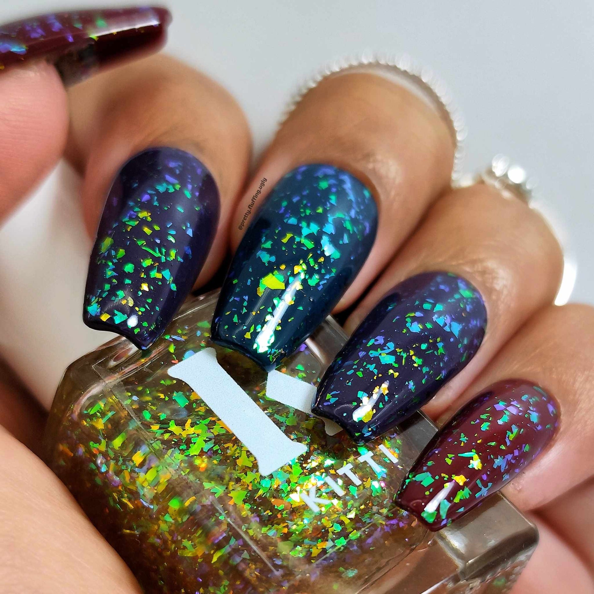 Flakie nail swatch on dark skin tone