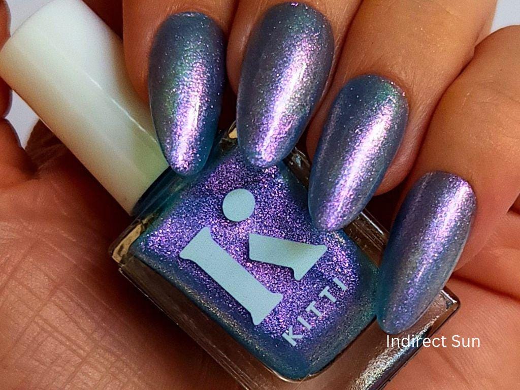Vegan blue shimmer nail polish on fair skin – cruelty-free and non-toxic